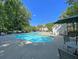 Community swimming pool with lounge chairs and patio furniture at 5222 Chicory Ln, North Charleston, SC 29420