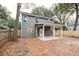 Gray house with covered patio and large backyard at 5635 Dobson St, North Charleston, SC 29406