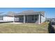 Backyard with a screened-in porch that's perfect for outdoor relaxing and entertaining at 723 Blue Iris Way, Summerville, SC 29486