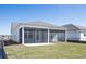 Spacious backyard features a screened-in porch and lush green lawn at 723 Blue Iris Way, Summerville, SC 29486