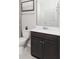 Simple bathroom with dark vanity and single sink at 723 Blue Iris Way, Summerville, SC 29486