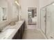 Double vanity bathroom with granite countertop and large shower at 723 Blue Iris Way, Summerville, SC 29486
