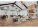 Elegant clubhouse lounge with vaulted ceilings, cozy seating, and a fireplace at 723 Blue Iris Way, Summerville, SC 29486