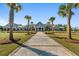 Community clubhouse with palm trees and brick pathway at 723 Blue Iris Way, Summerville, SC 29486