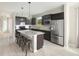 Modern kitchen featuring stainless steel appliances and an island at 723 Blue Iris Way, Summerville, SC 29486