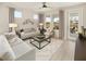 Cozy living room with comfy seating and access to backyard patio at 723 Blue Iris Way, Summerville, SC 29486
