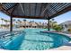 Relaxing view of the clear blue pool waters with covered pergola at 723 Blue Iris Way, Summerville, SC 29486