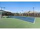 Well-maintained tennis court with lighting, showcasing community sports facilities at 723 Blue Iris Way, Summerville, SC 29486