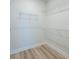 Walk-in closet with wood floors and built-in shelving provides ample storage space at 723 Blue Iris Way, Summerville, SC 29486