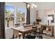 Dining room featuring a wooden table and chairs, and large windows at 1015 Marsh Harrier Dr # Cc3-3-2, Ravenel, SC 29470
