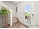 Inviting entryway with staircase and glass front door at 1015 Marsh Harrier Dr # Cc3-3-2, Ravenel, SC 29470