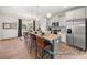 Modern kitchen with granite island, stainless steel appliances, and hardwood floors at 1015 Marsh Harrier Dr # Cc3-3-2, Ravenel, SC 29470