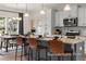 Modern kitchen with granite island, stainless steel appliances, and hardwood floors at 1015 Marsh Harrier Dr # Cc3-3-2, Ravenel, SC 29470