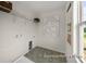 Convenient laundry room with ample shelving and storage at 1015 Marsh Harrier Dr # Cc3-3-2, Ravenel, SC 29470