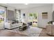 Living room with light gray sofa, sliding glass door, and hardwood floors at 1015 Marsh Harrier Dr # Cc3-3-2, Ravenel, SC 29470
