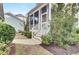 Landscaped backyard with walkway and shrubs at 1040 Hills Plantation Dr, Charleston, SC 29412