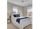 Bright bedroom with a queen-size bed and two windows at 1040 Hills Plantation Dr, Charleston, SC 29412