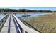 Community dock leading into the waterway with a floating dock at 1040 Hills Plantation Dr, Charleston, SC 29412