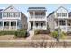 Two-story tan house with white columns, porch, and landscaping at 1040 Hills Plantation Dr, Charleston, SC 29412