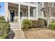 Front entrance with steps, landscaping, and a charming porch at 1040 Hills Plantation Dr, Charleston, SC 29412