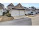 Two-car garage with white doors and neutral exterior at 1040 Hills Plantation Dr, Charleston, SC 29412