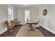 Home office with wooden desk, two chairs, and a large window at 1040 Hills Plantation Dr, Charleston, SC 29412