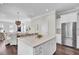 Open concept kitchen with white cabinets, island, and stainless steel appliances at 1040 Hills Plantation Dr, Charleston, SC 29412