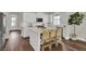 Modern kitchen with white cabinets, stainless steel appliances, and a kitchen island with seating at 1040 Hills Plantation Dr, Charleston, SC 29412