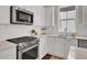 Modern kitchen features stainless steel appliances and white cabinets at 1040 Hills Plantation Dr, Charleston, SC 29412