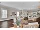 Living room with hardwood floors, neutral decor, and fireplace at 1040 Hills Plantation Dr, Charleston, SC 29412