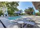 Community pool showcasing several lounge chairs and tables in a lovely setting at 1040 Hills Plantation Dr, Charleston, SC 29412