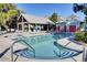 Community pool area showcasing the pool, lounge seating, hot tub, pool house, and picnic pavilion at 1040 Hills Plantation Dr, Charleston, SC 29412