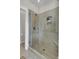 Walk-in shower with glass enclosure and neutral tile at 1040 Hills Plantation Dr, Charleston, SC 29412