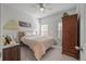 Comfortable bedroom with a queen-size bed and plenty of light at 1129 Sapling Dr, Summerville, SC 29485