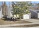 Tan house with white garage door and black shutters at 114 Keaton Brook Dr, Summerville, SC 29485