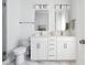 Modern bathroom with double vanity, white cabinets, and a glass shower at 1245 Crooked Oak Rd, Charleston, SC 29492