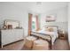 Cozy bedroom with a metal bed frame, dresser, and soft textiles at 1245 Crooked Oak Rd, Charleston, SC 29492