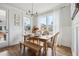 Bright dining area with farmhouse table and bench seating at 1245 Crooked Oak Rd, Charleston, SC 29492