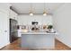 Modern kitchen with white cabinets, granite countertops, and a large island at 1245 Crooked Oak Rd, Charleston, SC 29492