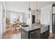 Open concept kitchen with island, stainless steel appliances, and farmhouse sink at 1245 Crooked Oak Rd, Charleston, SC 29492