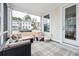 Relaxing screened porch with wicker furniture and string lights at 1245 Crooked Oak Rd, Charleston, SC 29492