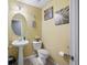 Small bathroom with pedestal sink and beige walls at 130 Decatur Dr, Summerville, SC 29486