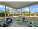 Relaxing screened porch overlooks backyard and trees at 130 Decatur Dr, Summerville, SC 29486