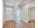 Bright entryway with wood-look floors and view into adjacent bathroom and room at 133 Summit View Dr, Summerville, SC 29486