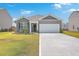 Gray house with white garage door and landscaping at 133 Summit View Dr, Summerville, SC 29486