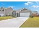 Gray house with white garage door and landscaping at 133 Summit View Dr, Summerville, SC 29486