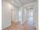 Bright hallway with wood flooring and access to rooms at 133 Summit View Dr, Summerville, SC 29486