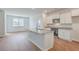 Kitchen boasts white cabinets, granite countertops, and stainless steel appliances at 133 Summit View Dr, Summerville, SC 29486