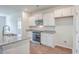 Modern kitchen with white cabinets and granite countertops at 133 Summit View Dr, Summerville, SC 29486