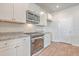 White kitchen cabinets and granite countertops with stainless steel appliances at 133 Summit View Dr, Summerville, SC 29486